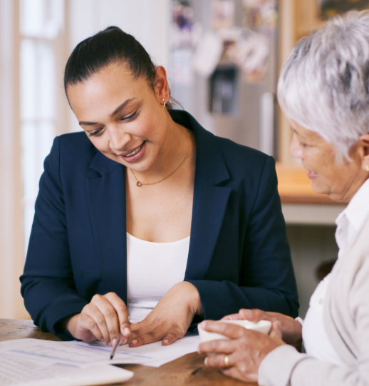 A TD Wealth Manager looking at documents with an older women.